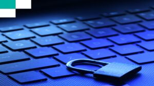 Physical padlock resting on a laptop keyboard