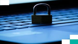 Close-up of a lock placed on a computer keyboard.