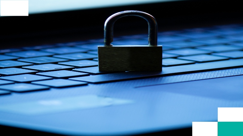 Close-up of a lock placed on a computer keyboard.